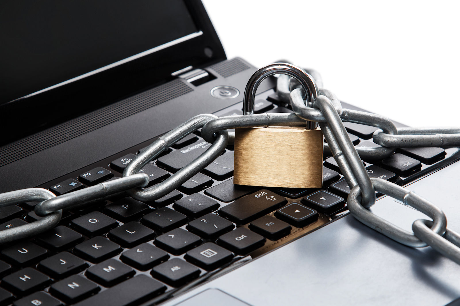 Padlock and chain on a laptop keyboard. Concept of internet security